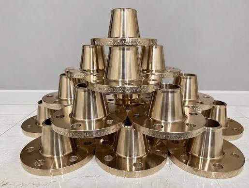 Stack of bronze hubbed flanges with tapered hubs and smaller bores