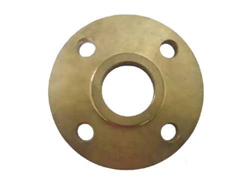 Flat bronze plate flange with central bore and four drilled bolt holes